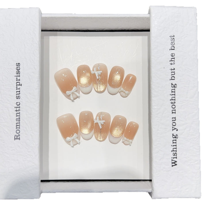 Artificial nails with romantic bow and glitter effects Stornfield
