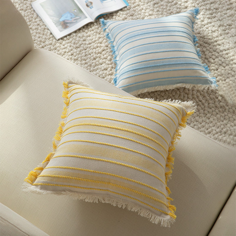 Square cushion cover made of hand-woven cotton blend with decorative fringe trim Stornfield