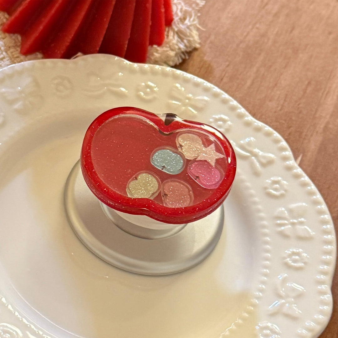 Funnier apple motif smartphone finger holder Stornfield
