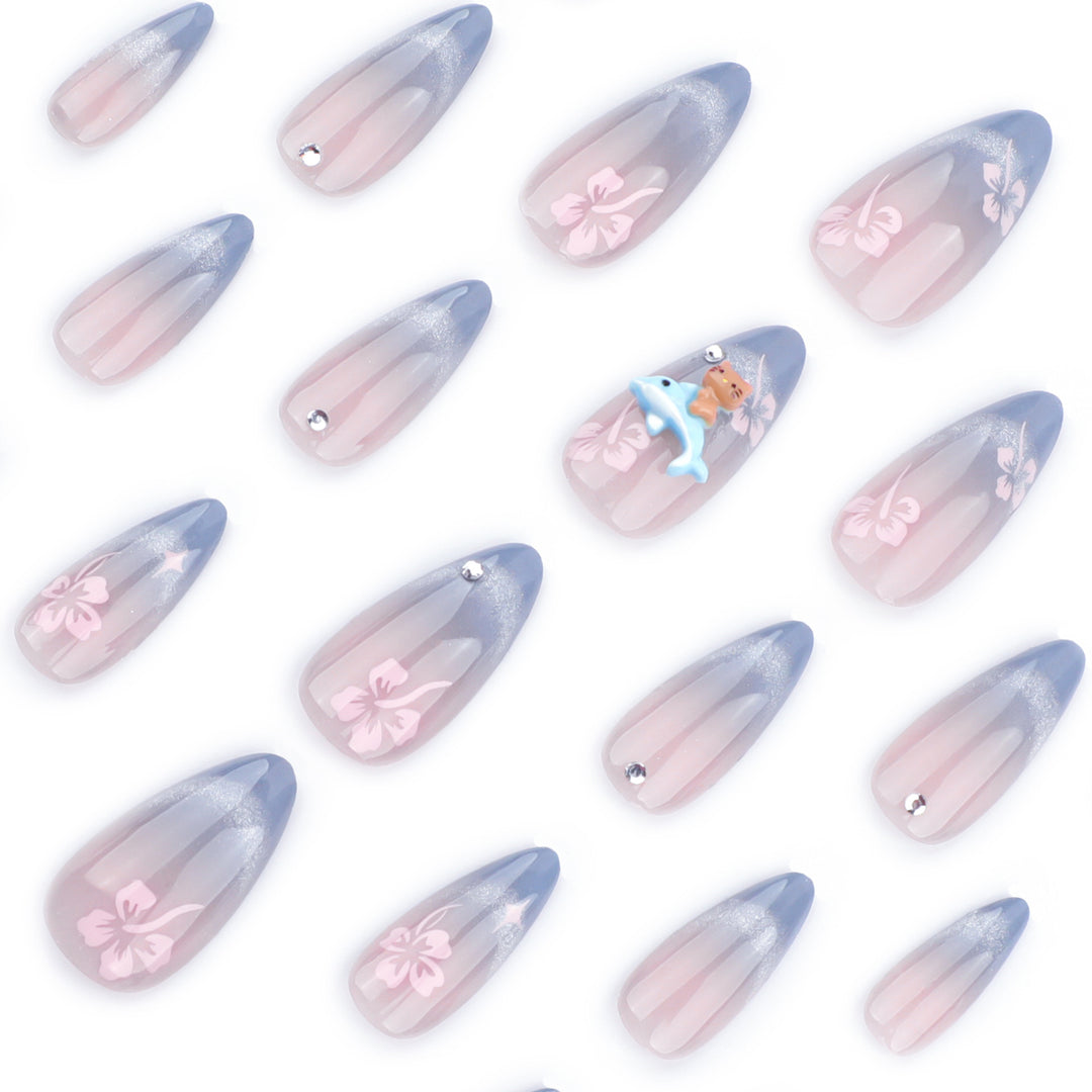 Artful nail extensions with elegant ombré design and floral accents Stornfield