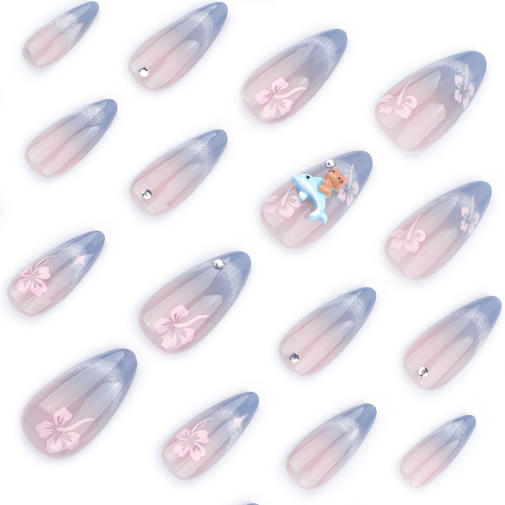 Artful nail extensions with elegant ombré design and floral accents Stornfield