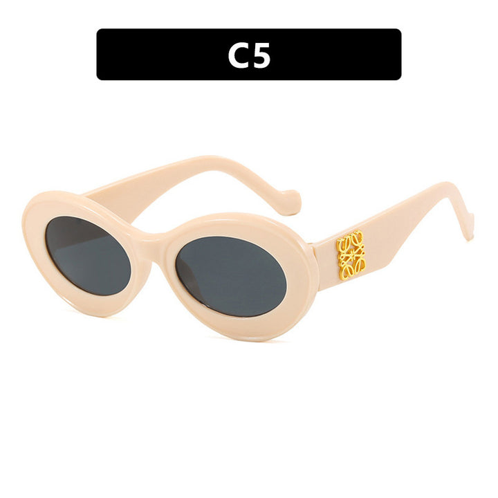 Women's fashionable sunglasses with oval frame and golden accents Stornfield
