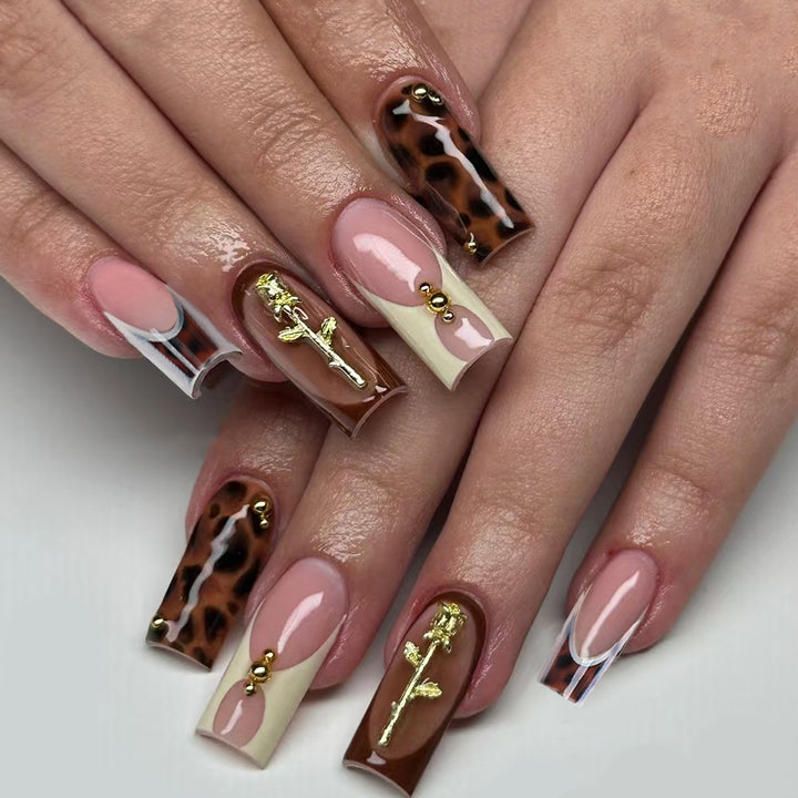 Artificial nails with luxurious embellishments and animalistic design Stornfield
