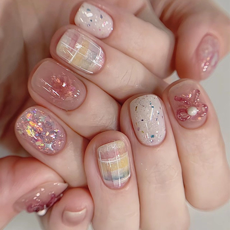 Creative nail art set with glitter and floral applications Stornfield