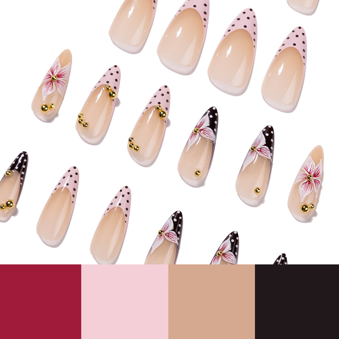 Artful stiletto nails with floral accents and glitter Stornfield