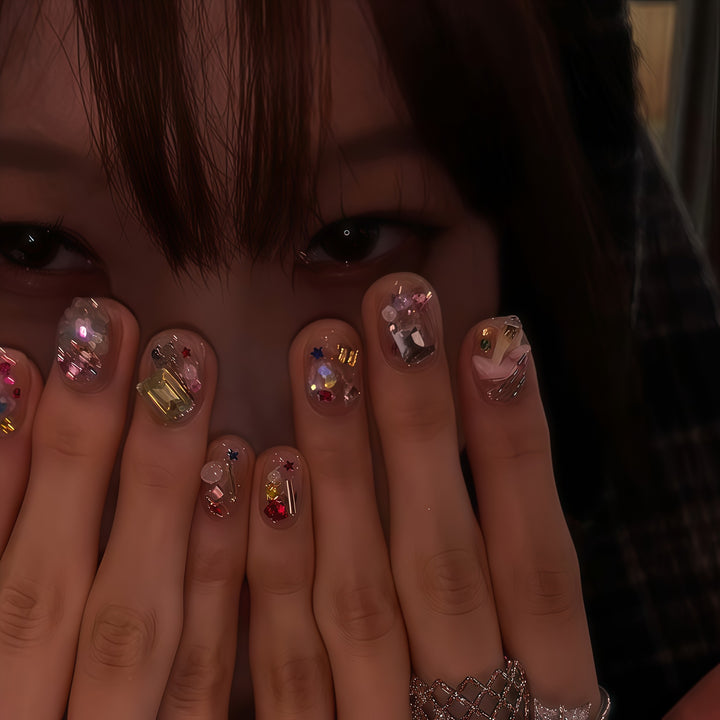 Artificial nails with sparkling crystal accents Stornfield