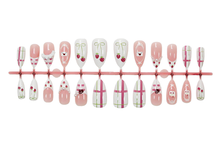 Artificial nail set with playful flowers and elaborate decorations Stornfield