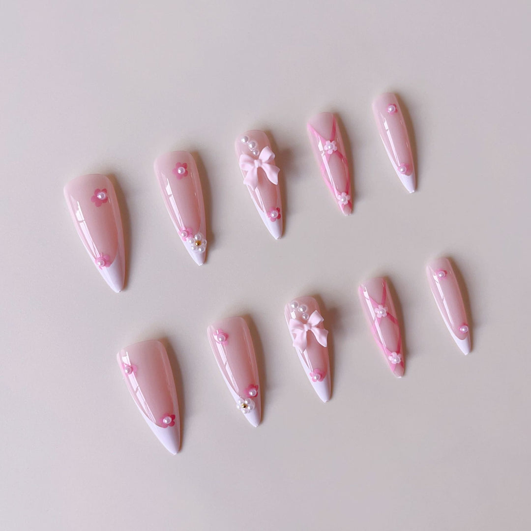 False nail set with playful 3D details and elegant accents Stornfield