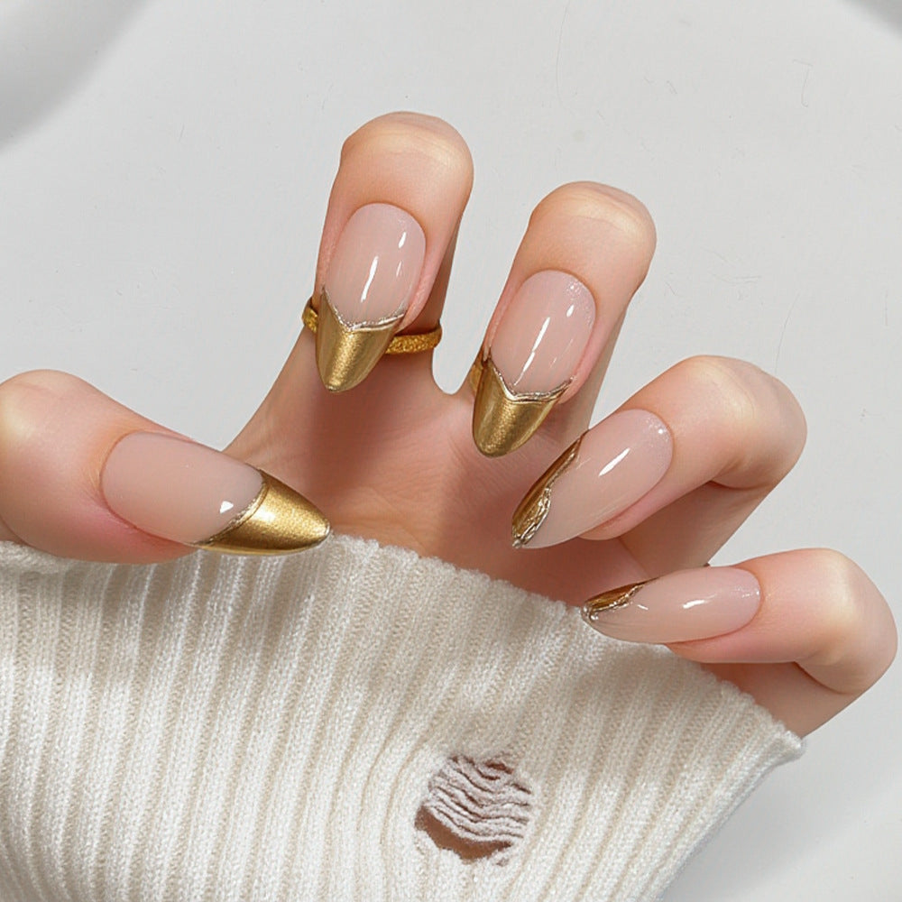 Artificial nails in elegant stiletto design with gold accents Stornfield
