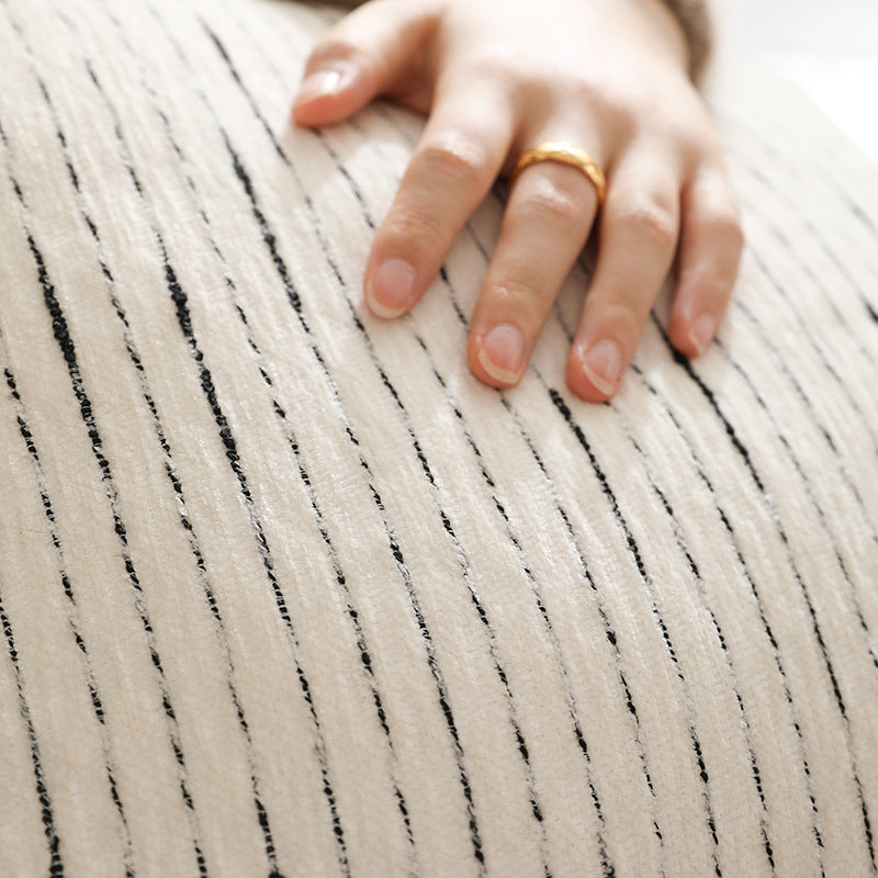 Rectangular quilted decorative cushion with fine line embroidery and natural linen texture
