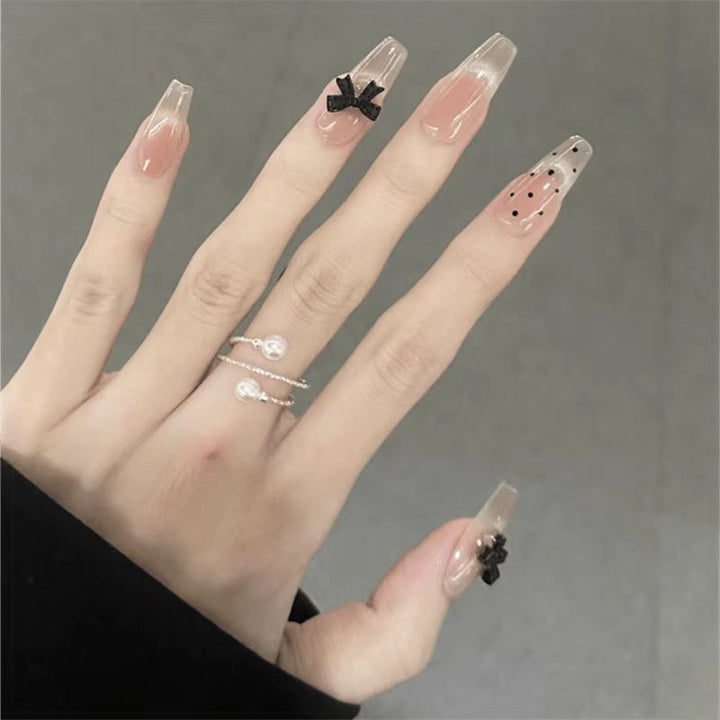 Artificial nails with playful bow design Stornfield