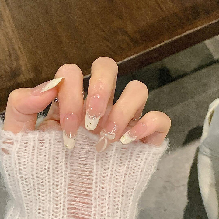 Artificial nails with elegant tip embellishment and romantic details Stornfield