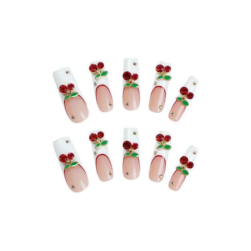 Artificial nail set with cherry motif and sparkling rhinestones Stornfield