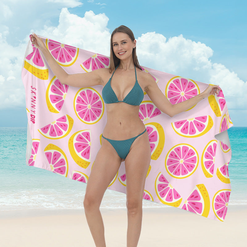 Beach towel with vibrant tropical plant motif Stornfield