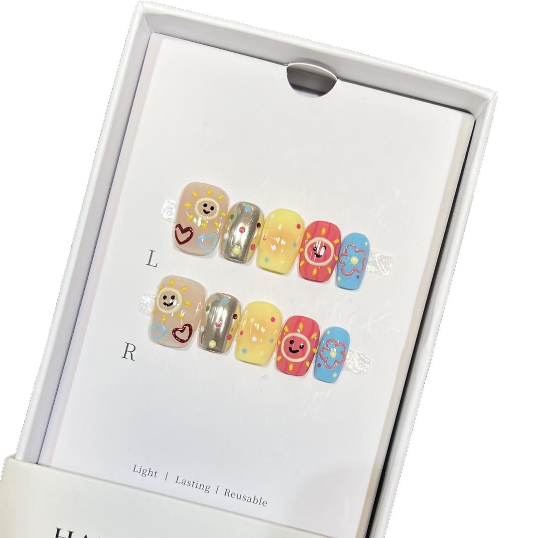 Whimsical Press-On Nail Art Set with Smiley Faces and Floral Designs Stornfield