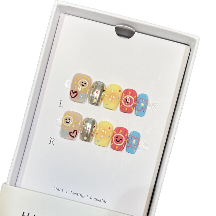 Whimsical Press-On Nail Art Set with Smiley Faces and Floral Designs Stornfield