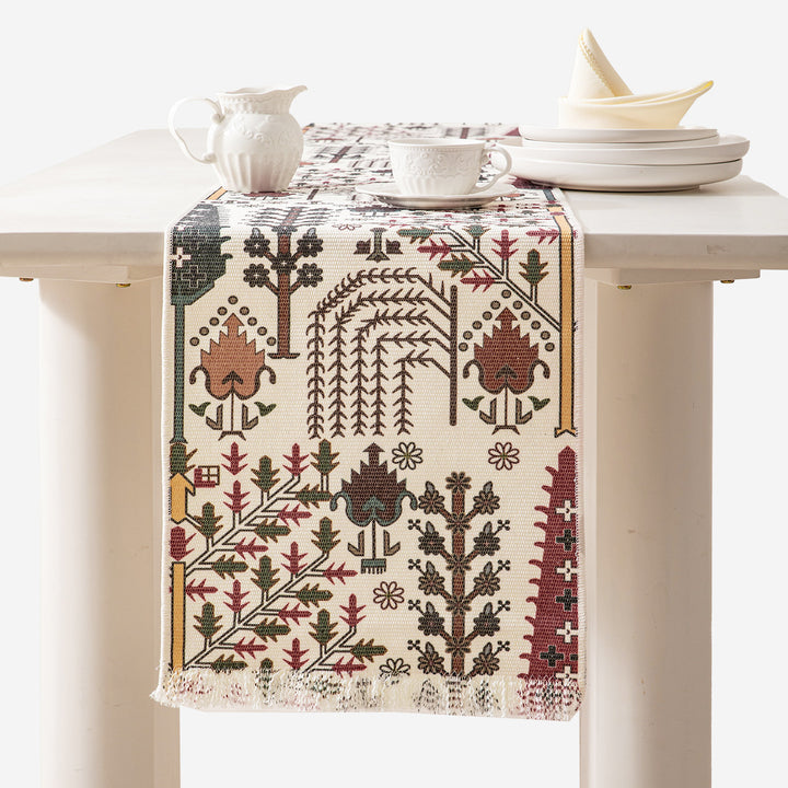 Woven table runner with flower jacquard, fringes and cotton blend