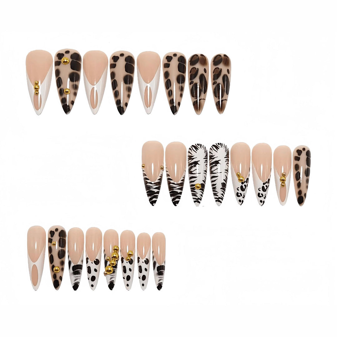 Stiletto fake nails with animal pattern and gold accents Stornfield