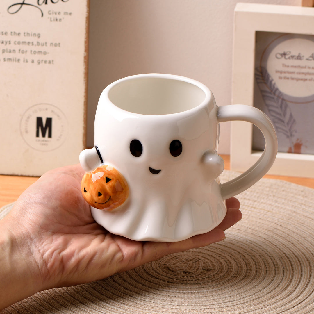 Ceramic mug with 3D ghost shape and pumpkin appliqué