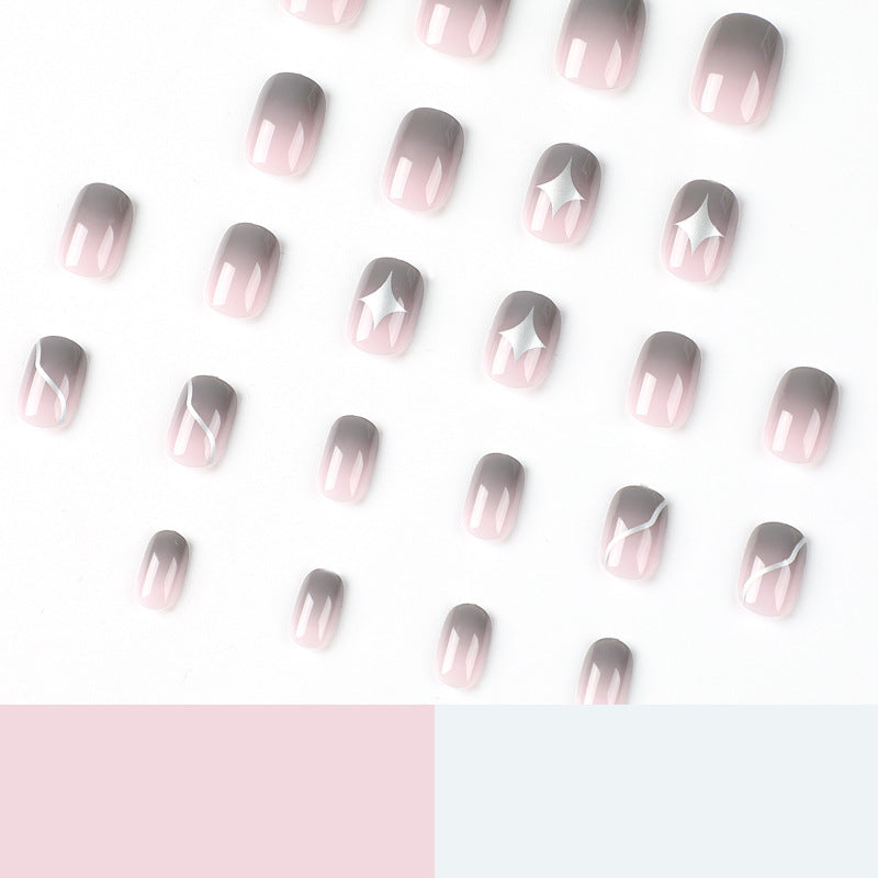 Artificial nail art with elegant ombre design and charming accents Stornfield