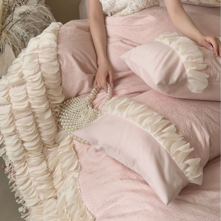 Romantic ruffle bedding set with layered frill and quilted bedspread