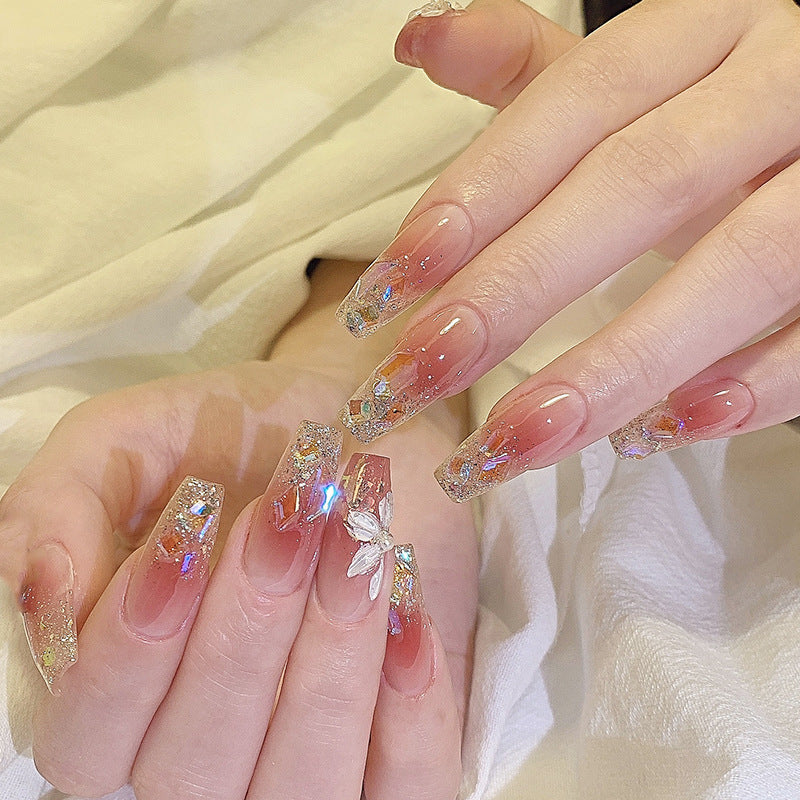 Artificial nail set with floral and glittering accents Stornfield