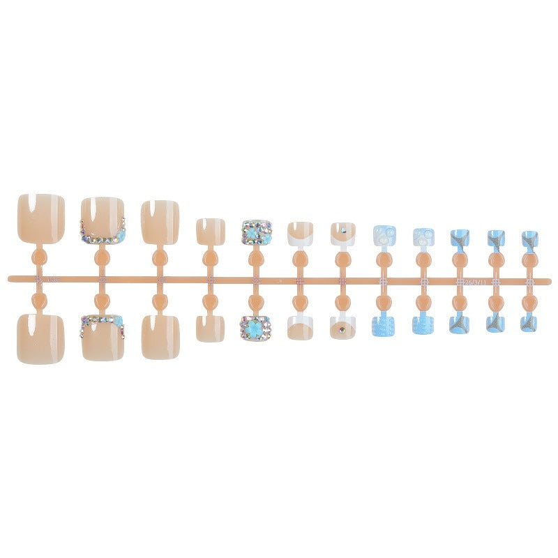 Glamorous artificial nail creation with elegant embellishments Stornfield