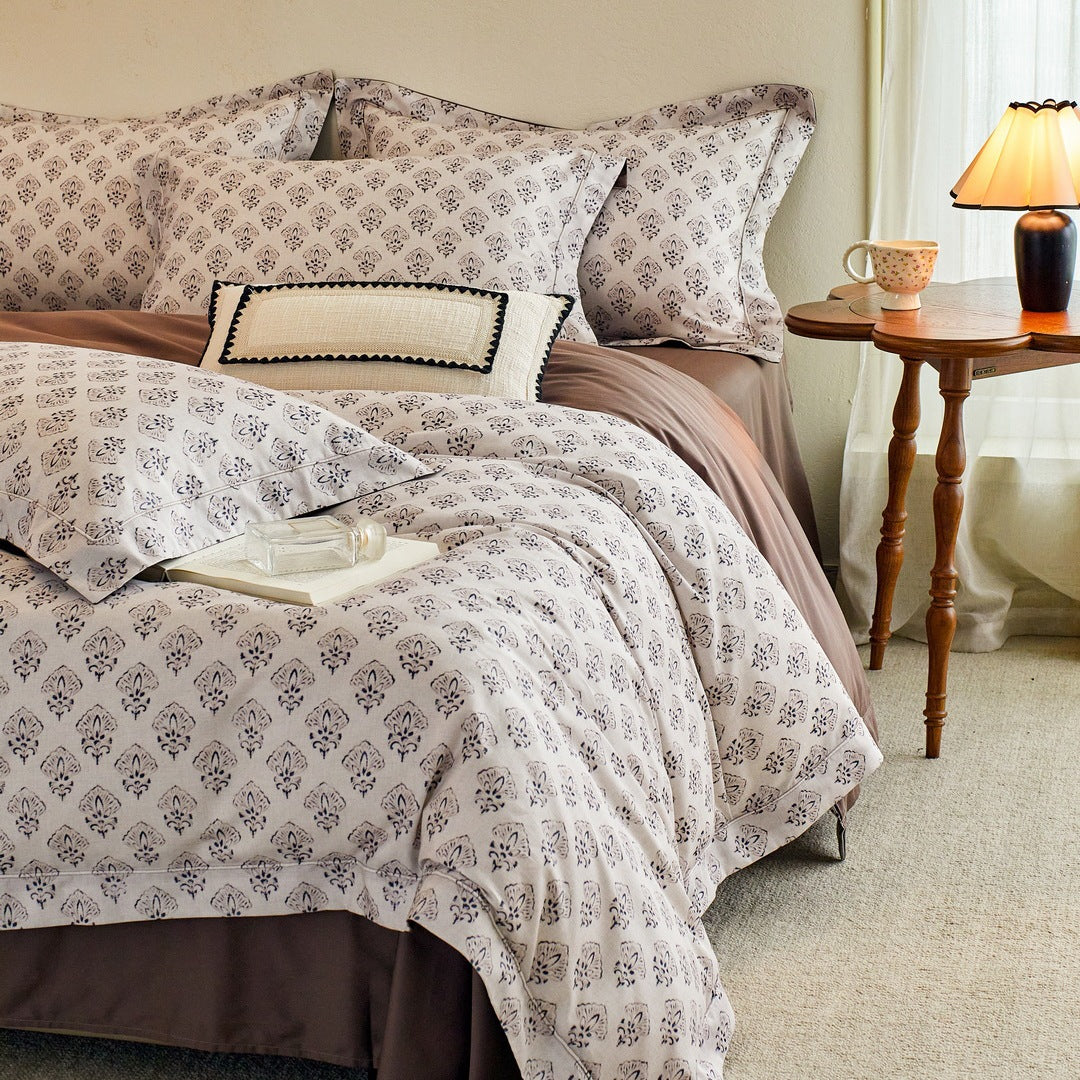 Luxurious cotton satin bed linen set with millefleurs floral pattern and fine piping