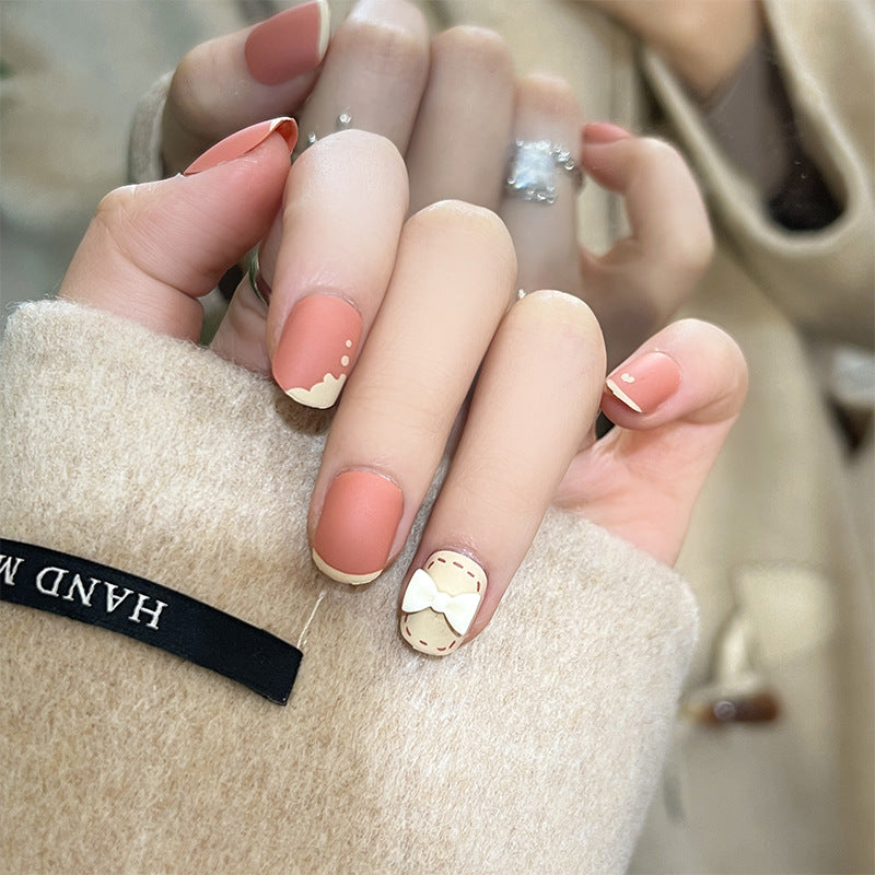 Artistic nail nails with decorative bow designs and French tips Stornfield