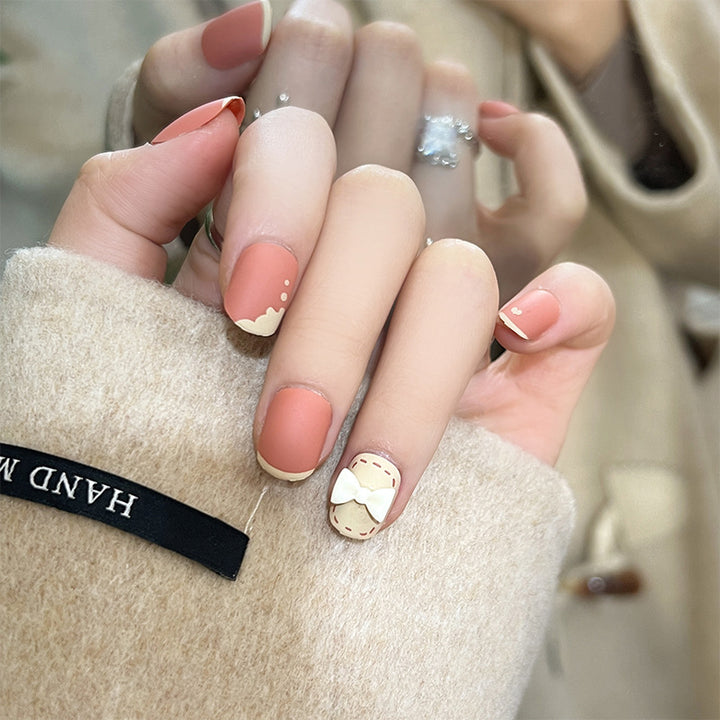 Artistic nail nails with decorative bow designs and French tips Stornfield