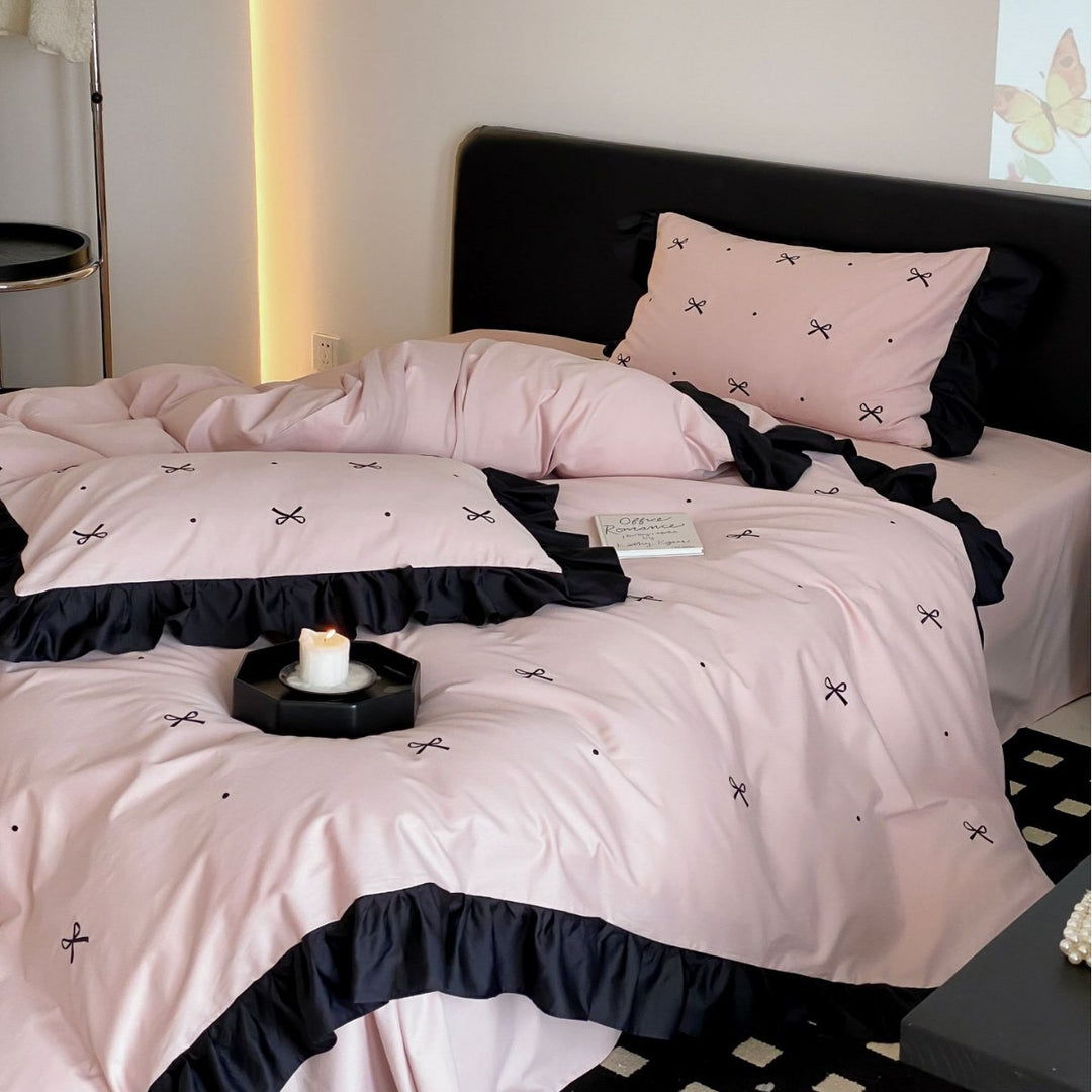 Reversible cotton satin bedding set with fine bow embroidery and ruffled edge