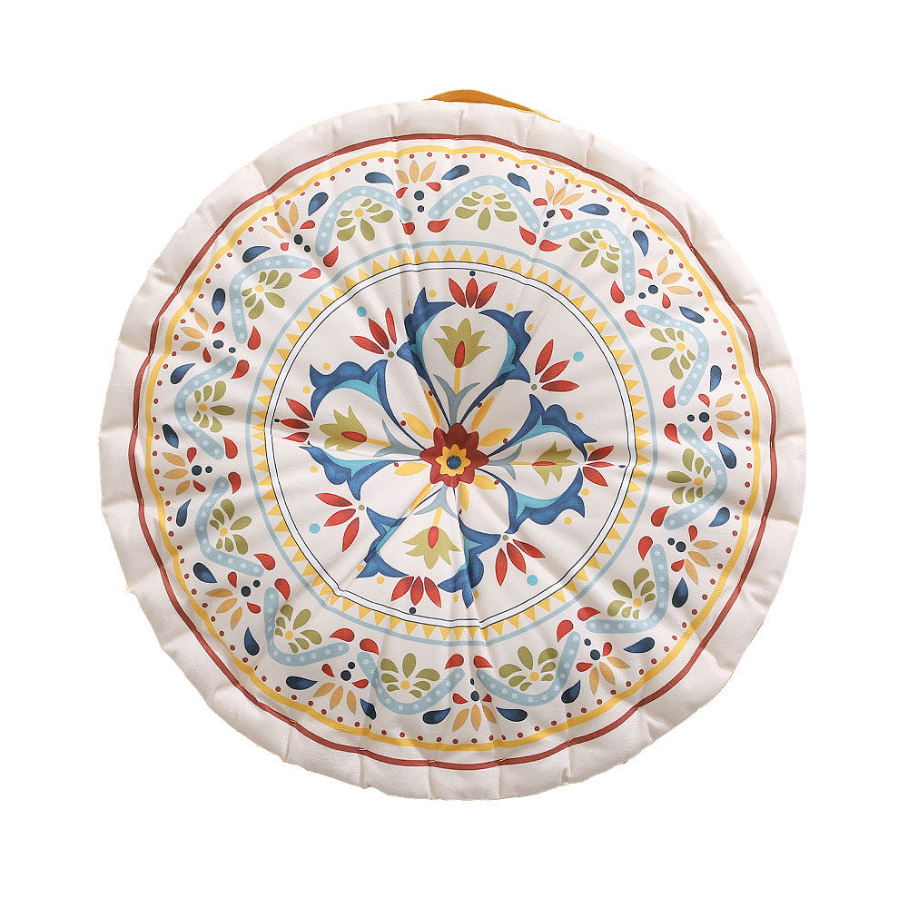 Round floor cushion with medal print, carrying handle and quilted padding