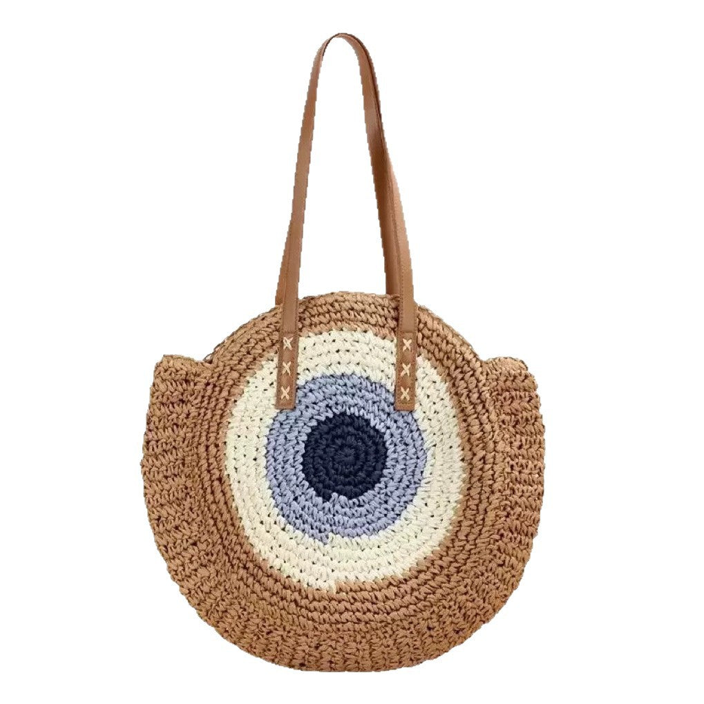 Braided basket bag with unique round design and elegant shoulder straps Stornfield