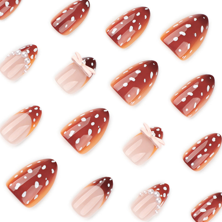 Artificial nail art with dot pattern and bow accents Stornfield