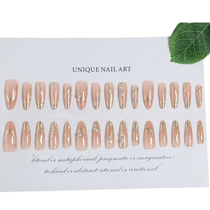 Artificial nail set with elegant gold design and sparkling applications Stornfield