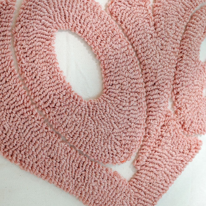 Playful decorative cushion with heart design