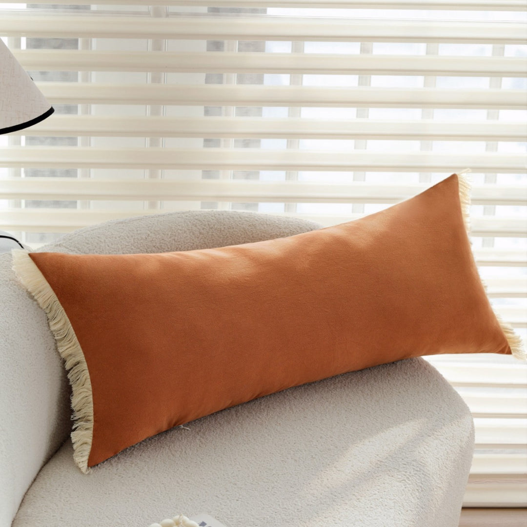 Elegant decorative cushion with fringe decoration