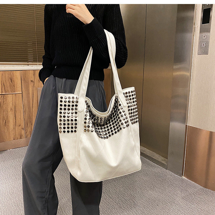 Fashionable shoulder bag with stylish rivet details Stornfield