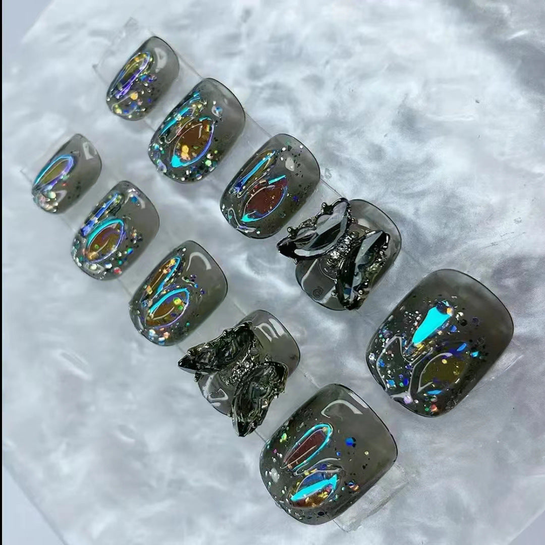 Elegant nail design with bow and rhinestone details Stornfield