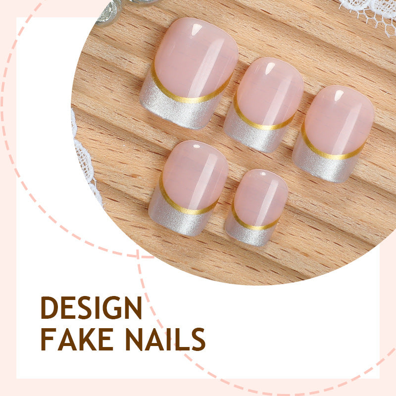 Artificial nail creations with elegant gold trim Stornfield