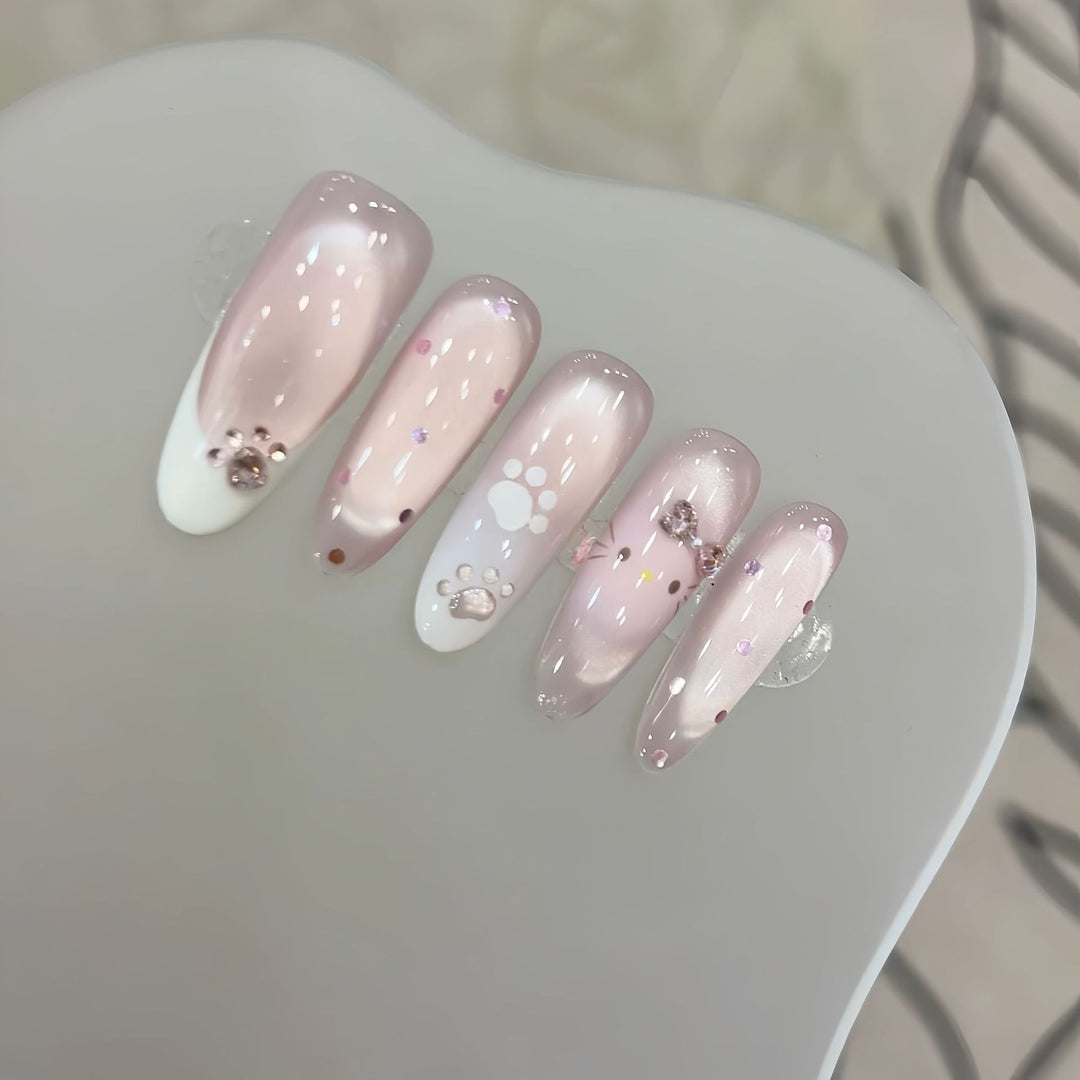 Artificial nail tips with playful penguin and paw print design Stornfield