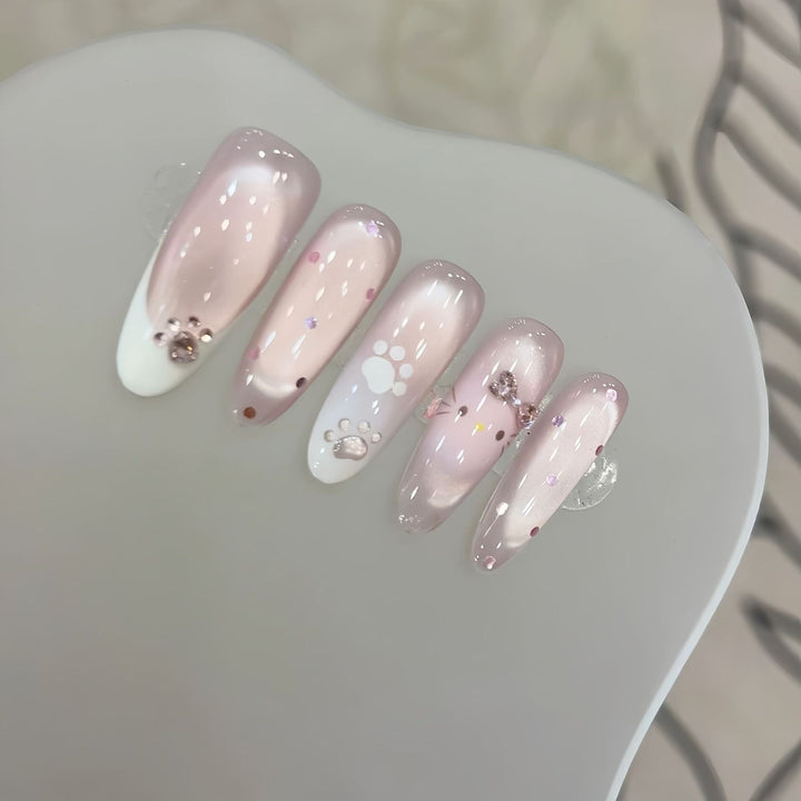 Artificial nail tips with playful penguin and paw print design Stornfield