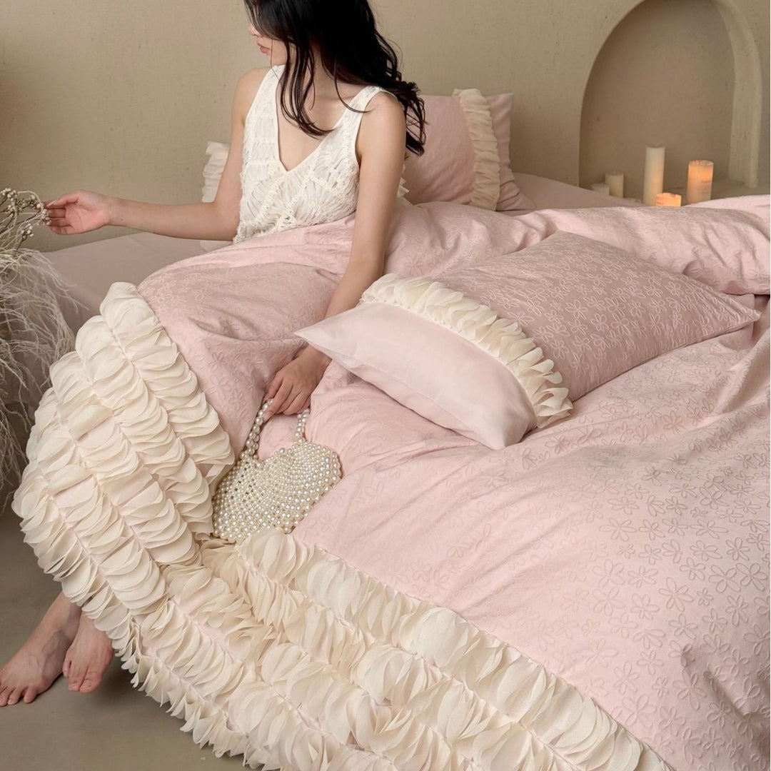 Romantic ruffle bedding set with layered frill and quilted bedspread