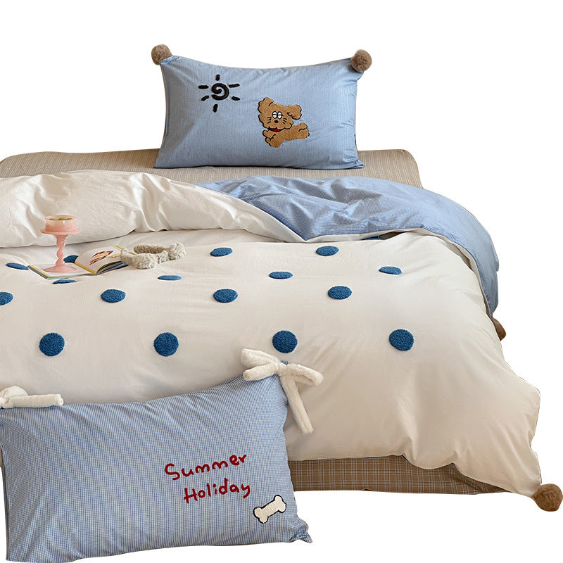 Children's bedding set with striped duvet cover, checkered decorative pillow, and plush application