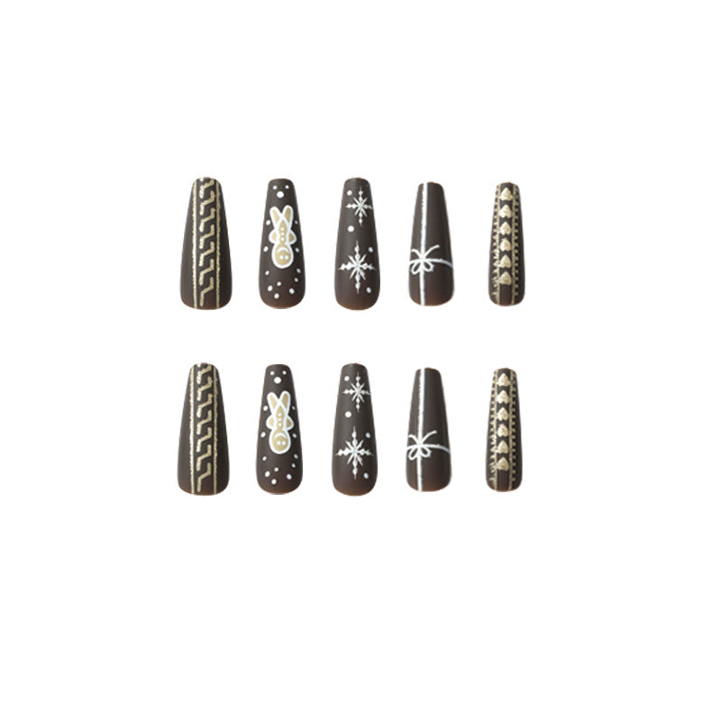 Artificial nail art with festive gingerbread design Stornfield
