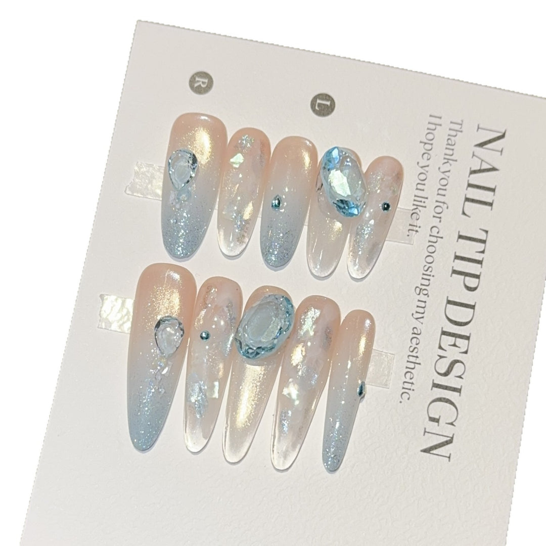 Artificial nails with rhinestones and glitter effects Stornfield