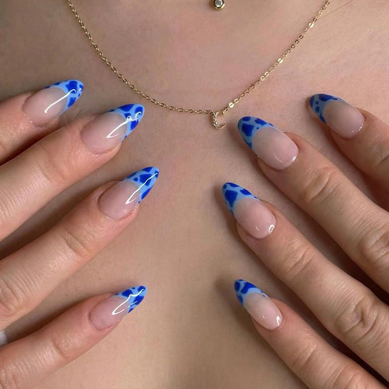 Artful nail extensions with an elegant leaf pattern Stornfield