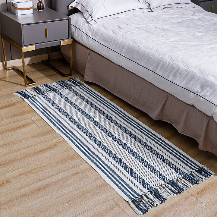 Flat-woven cotton runner with fringes and graphic ethnic stripe pattern Stornfield