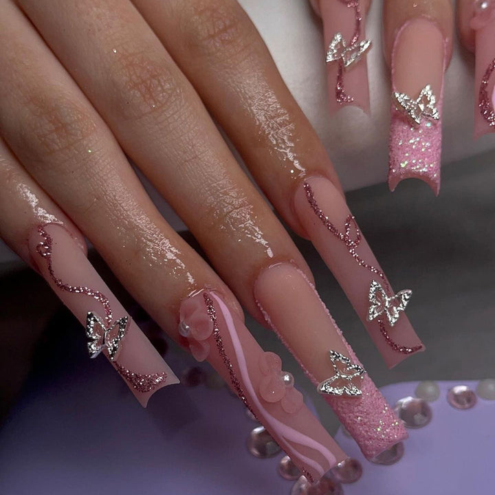 Exquisite Fingernails with Glitter and Decorative Elements Stornfield