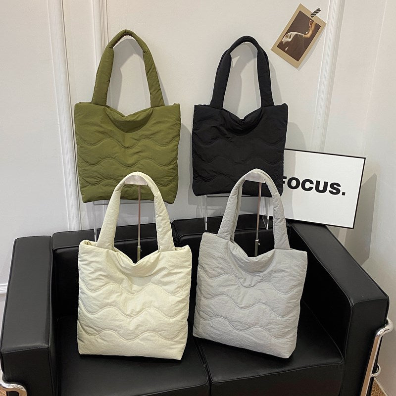 Padded shoulder bag with wave design Stornfield
